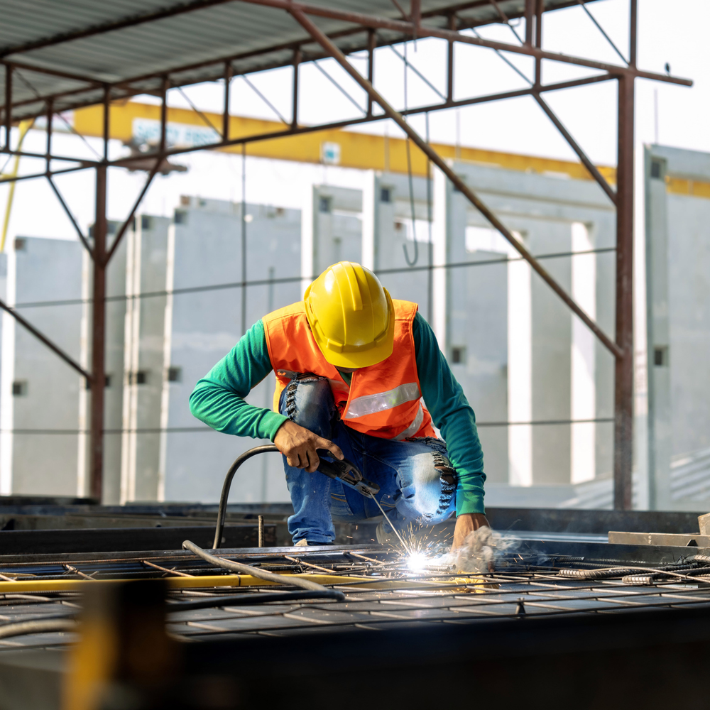 construction working welding a metal frame